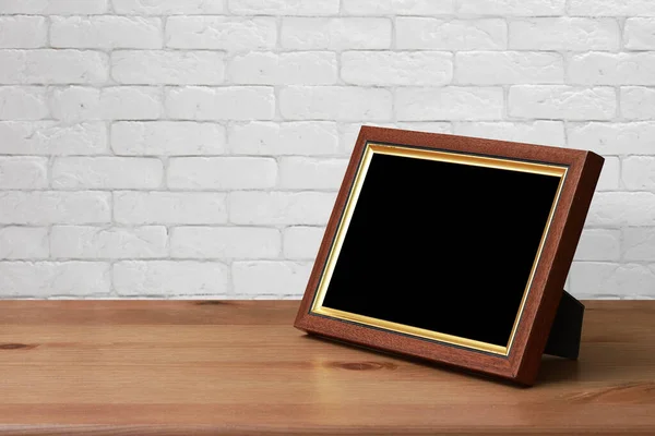 Old Photo Frame Wooden Table White Brick Wall — Stock Photo, Image