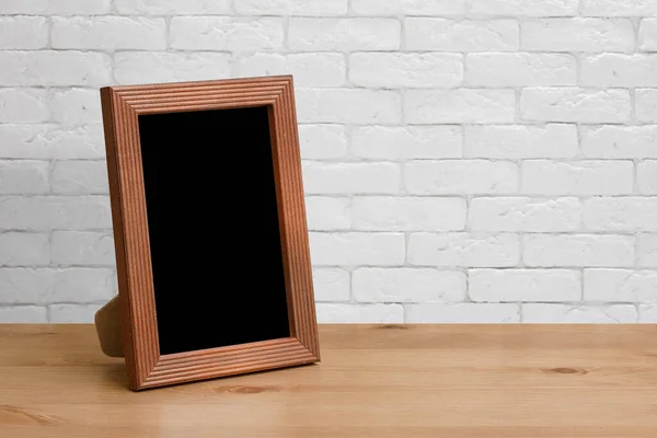 Old Photo Frame Wooden Table White Brick Wall Stock Photo