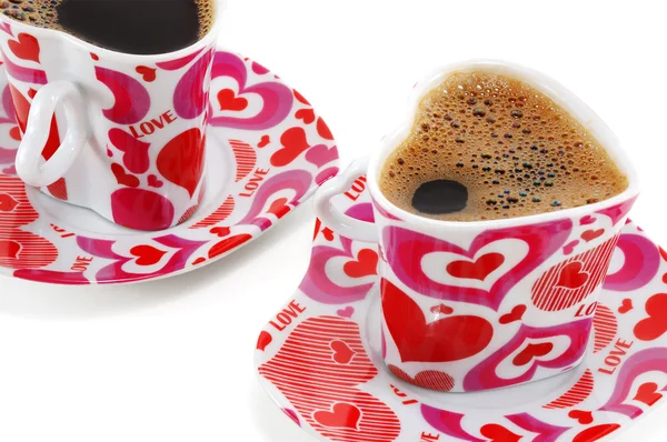 Two cups with coffee in the form of heart — Stock Photo, Image