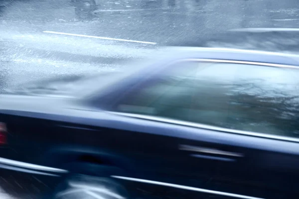 Speedy car in rain