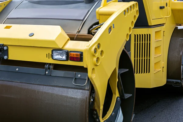 Yellow road roller closeup