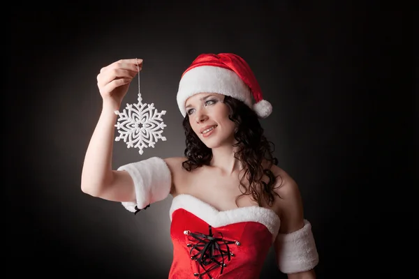 Santa girl hospodářství vločka Stock Obrázky