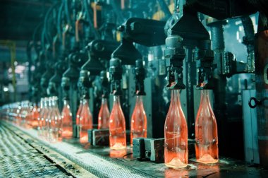 Row of hot orange glass bottles clipart