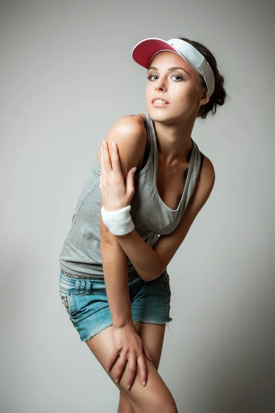 Young woman in sports clothing — Stock Photo, Image