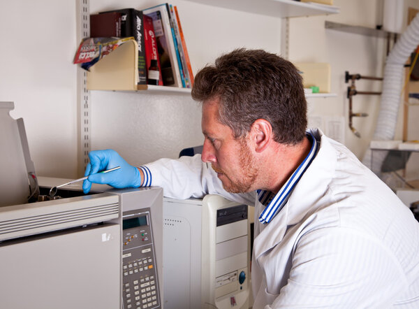 Scientist performs chromatograph mirror test