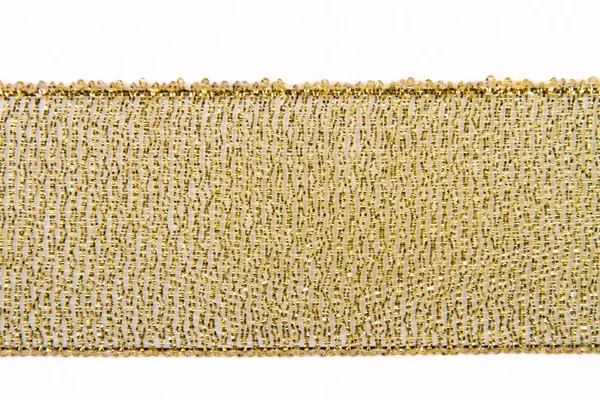 Tranças de fita largas de ouro em um fundo branco — Fotografia de Stock