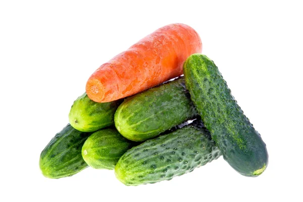 Ripe cucumbers and carrots on a white background — Stock Photo, Image