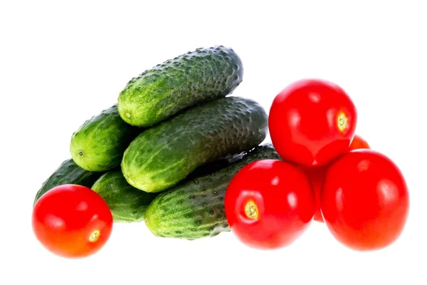 Ripe tomatoes and cucumbers on a white background — Stock Photo, Image