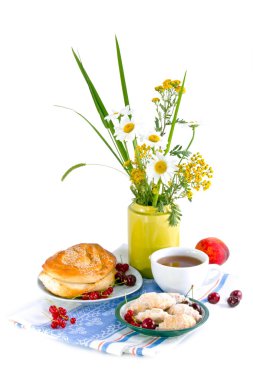 Still life with flowers and red currant bun clipart