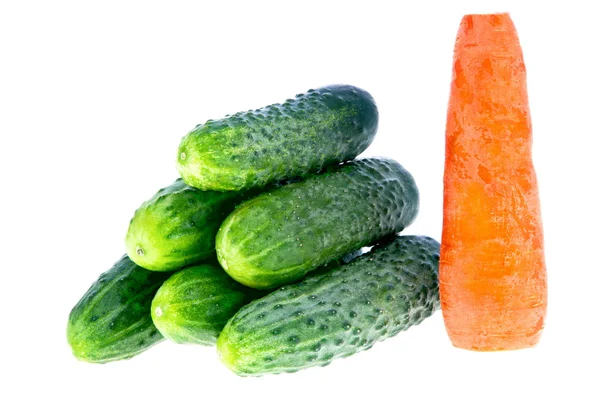 Ripe cucumbers and carrots on a white background — Stock Photo, Image