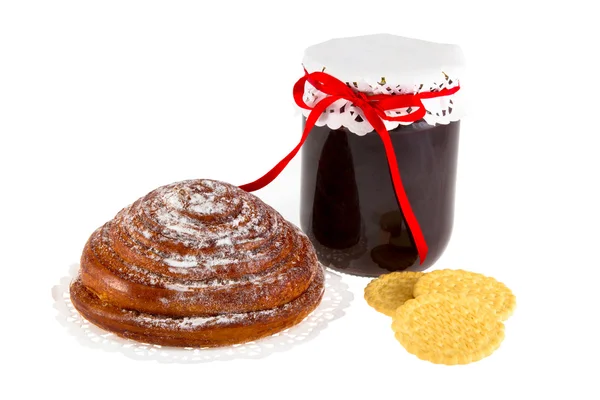 Bun and a jar of jam — Stock Photo, Image