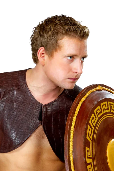 Young male warrior with a shield — Stock Photo, Image