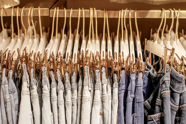 Preview jeans hanging on a hanger in the store — Stock Photo, Image