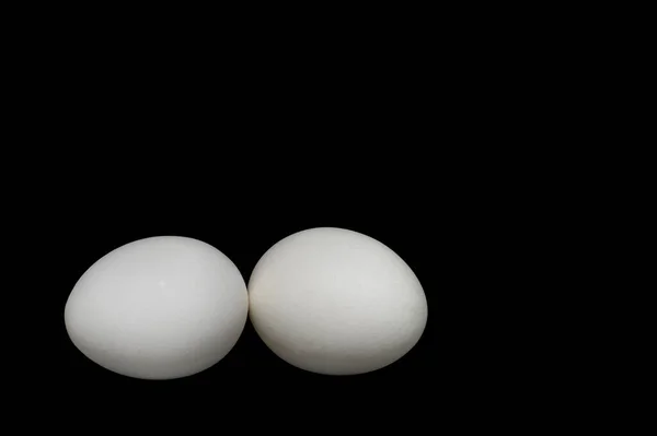 Image Two White Chicken Eggs Black Background — стоковое фото