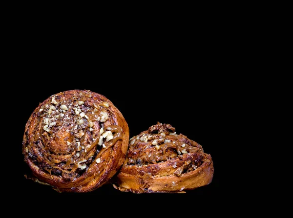 Image Two Delicious Buns Cream Nuts Black Backgroun — стоковое фото