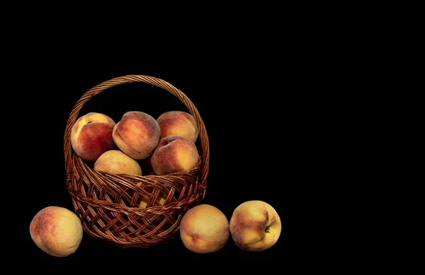 Image Basket Harvest Ripe Peaches Black Background — стоковое фото