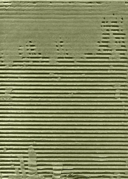 带有天然纤维零件的有纹理波纹条纹绿色纸板 图库图片