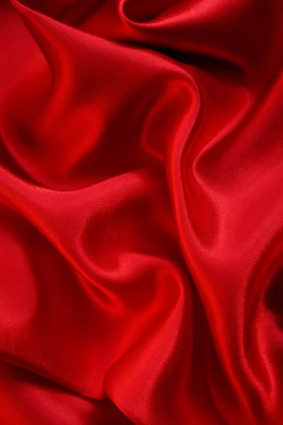 Smooth red silk as background Stock Photo