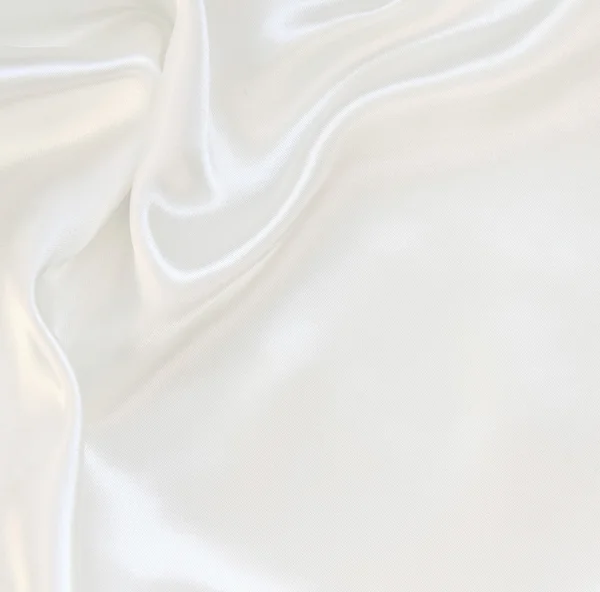 ผ้าไหมสีขาวเรียบหรูเป็นพื้นหลังงานแต่งงาน — ภาพถ่ายสต็อก