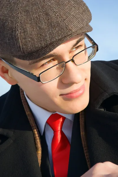 A young man in classic clothes and glasses. — Stock Photo, Image