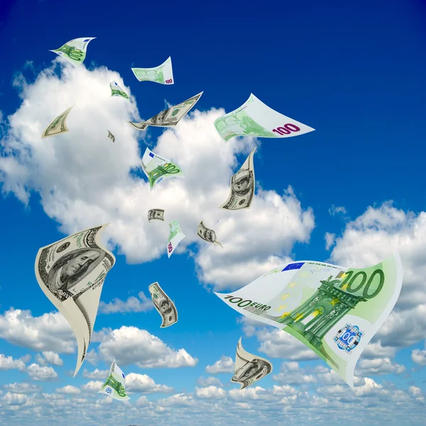 Money flying out of the sky. Royalty Free Stock Images