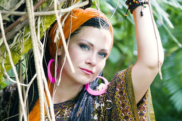 Beautiful blue-eyed woman with the african pigtails