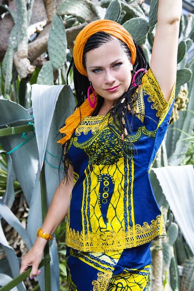 Beautiful blue-eyed woman with the african pigtails — Stock Photo, Image