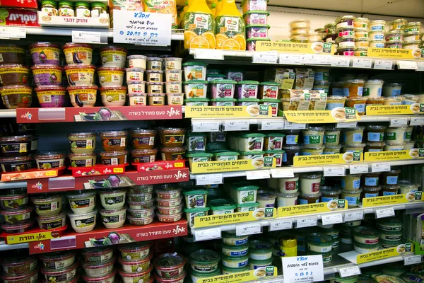 Shelves with foods in supermarket — Stock Photo, Image