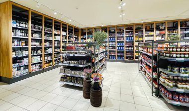 LATVIA, RIGA, JUNE, 2022 - A sales area with modern equipment and a large selection of quality gastronomic products in a shopping center in Riga, Latvia