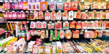 LATVIA, RIGA, OCTOBER, 2021 - Traditional smoked salami and other types of meat from different manufacturers in shopping mall, Riga, capital of Latvia.
