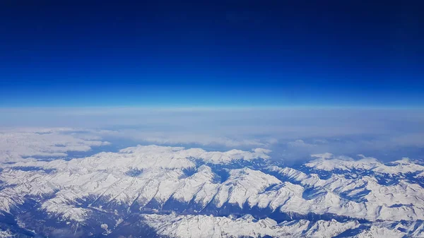 Top View Airplane Window Snowy Peaks Swiss Alps Background Blue — Stock Photo, Image