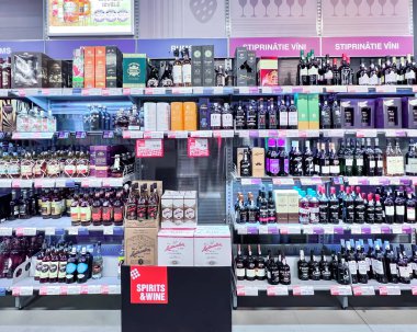 LATVIA, RIGA, JULY, 2022 - Interior of modern wine boutique store. Shelves with various of wines with special prices in the SPICE shopping mall, Riga, Latvia