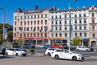 LATVIA, RIGA, AUGUST, 2022: Parking of white taxis at Riga Central Station in the center of Riga, capital of Latvia