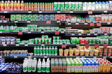 Latvia, Riga, August, 2022 - Delicious and healthy bio dairy products on shelf of supermarket. Natural products without milk fat substitute. Food quality concept.