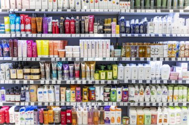 LATVIA, RIGA, AUGUST, 2022: Shelves with shampoos and conditioners with reduced prices on sale in Rimi Baltic hypermarket, Riga. Latvia. Rimi Baltic is a major retail operator in the Baltic states