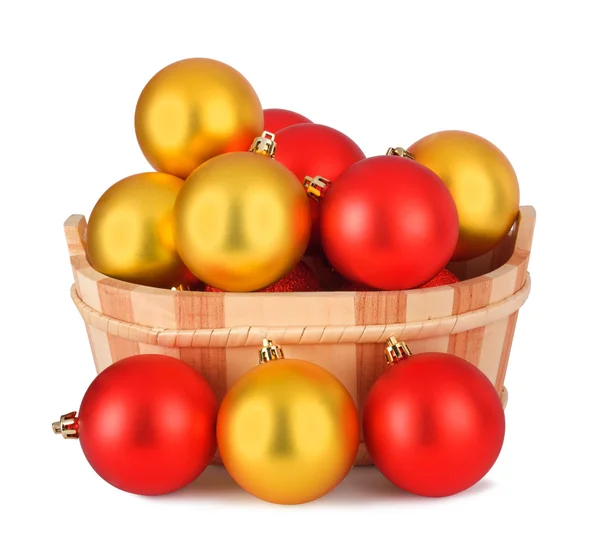 Wooden basket with a set of colorful Christmas balls isolated on — Zdjęcie stockowe