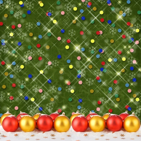 Bola de Natal com cartão de saudação no abstrato espumante de volta — Fotografia de Stock