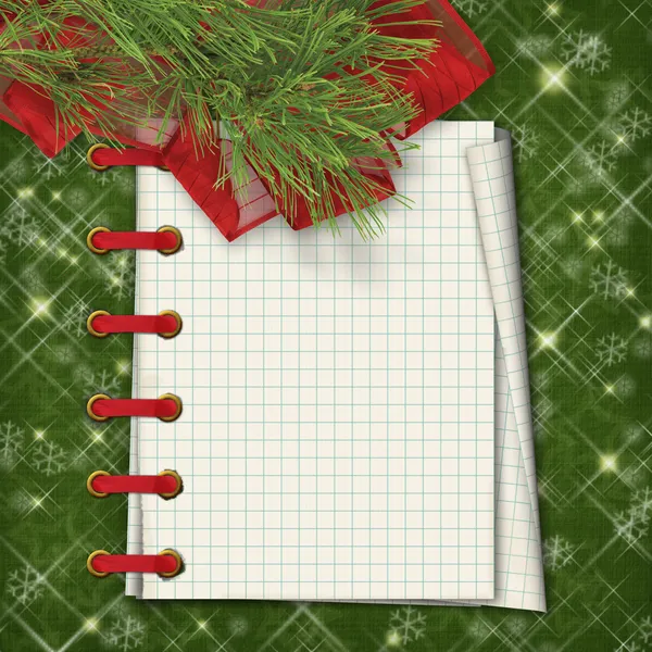 Christmas greeting card with firtree and notebook on the green — Stock Photo, Image