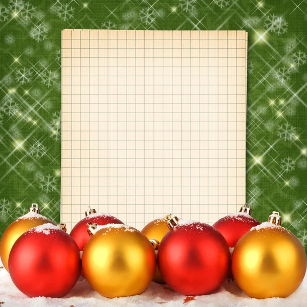 圣诞球与笔记本上抽象波光粼粼艾菲尔铁塔的背景 — 图库照片