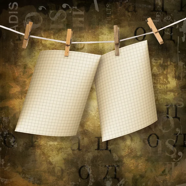 Eski sayfaları bir ip ve clothespins kahverengi abstra üzerinde asılı — Stok fotoğraf