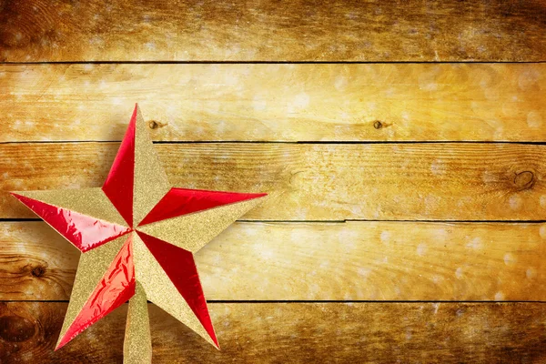 Traditional Christmas star on background of wooden wall — Stock Photo, Image