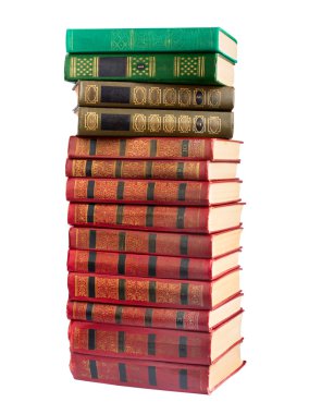 bir yığın altın damgalama üzerinde beyaz bir arka plan ile eski kitaplar