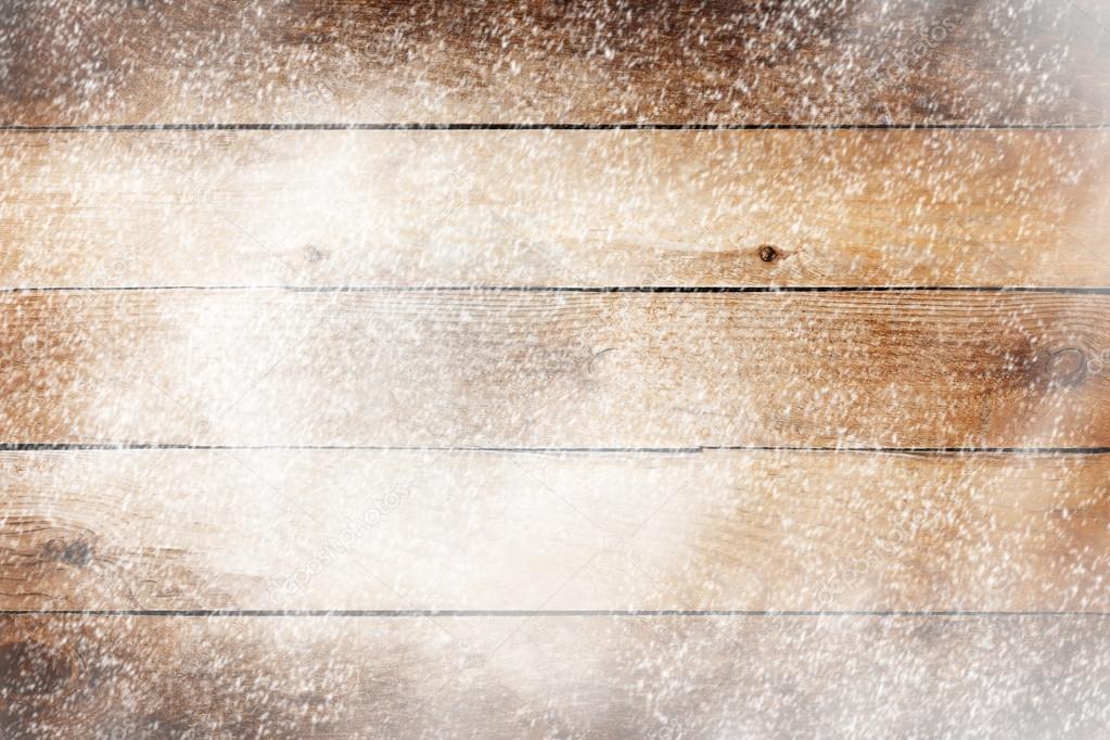 Old wooden background with snow for design