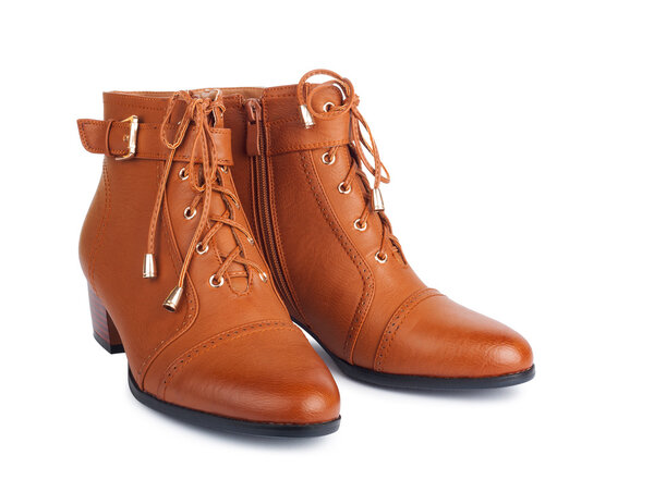 Pair of brown female boots isolated on white background