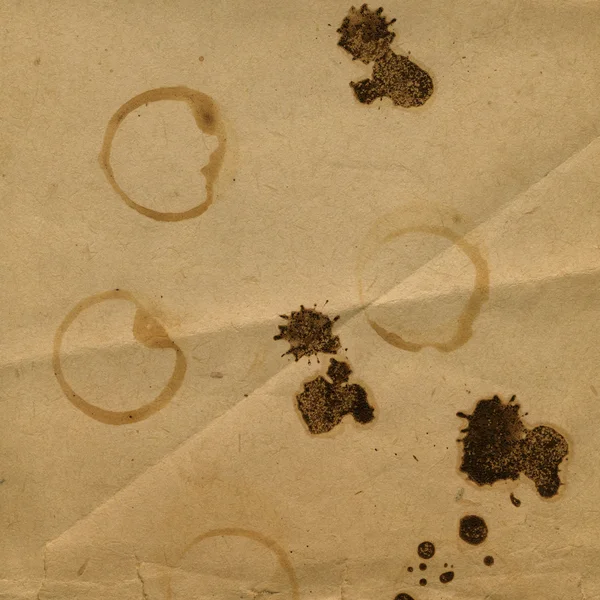 Old crumpled paper with stains of coffee or tea — Stock Photo, Image