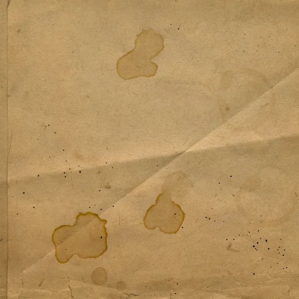 Old crumpled paper with stains of coffee or tea — Stock Photo, Image