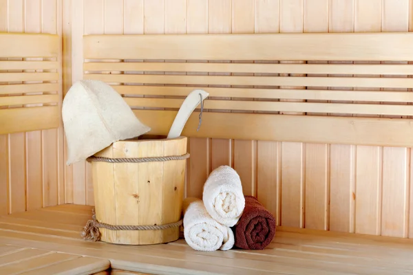 Traditional wooden sauna for relaxation with bucket of water — Stock Photo, Image