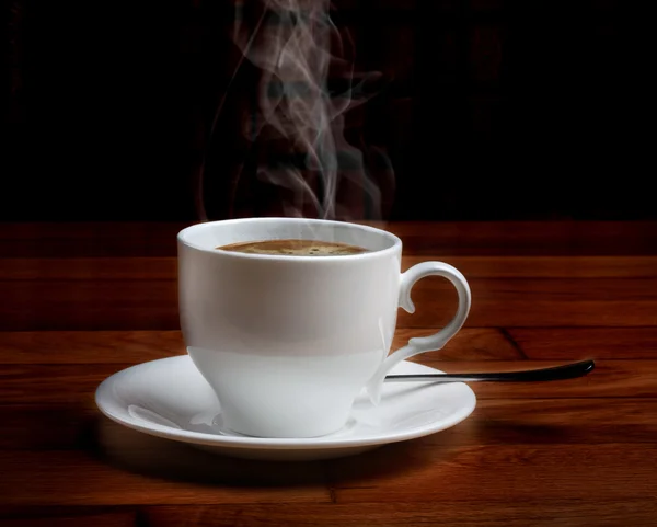 Hot fresh coffee in a white cup with sugar — Stock Photo, Image