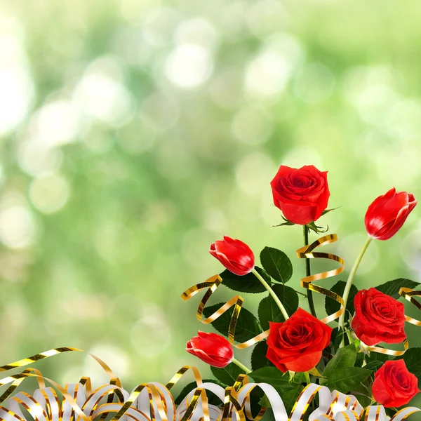 Bouquet of red roses and tulips