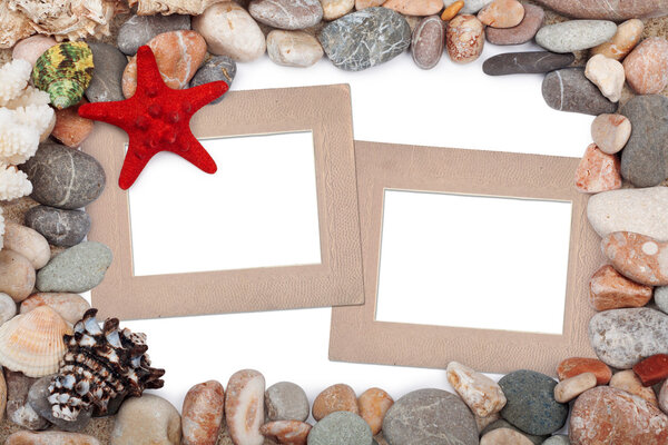 Paper Vintage photo frames with red starfish and pebbles